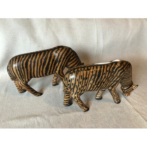 178 - A pair of hand carved wooden trbal art Zebras