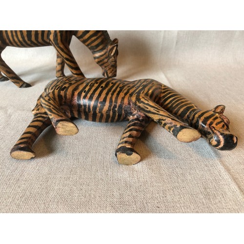 178 - A pair of hand carved wooden trbal art Zebras