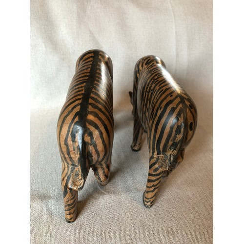 178 - A pair of hand carved wooden trbal art Zebras