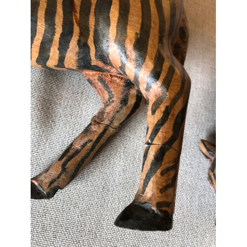 178 - A pair of hand carved wooden trbal art Zebras