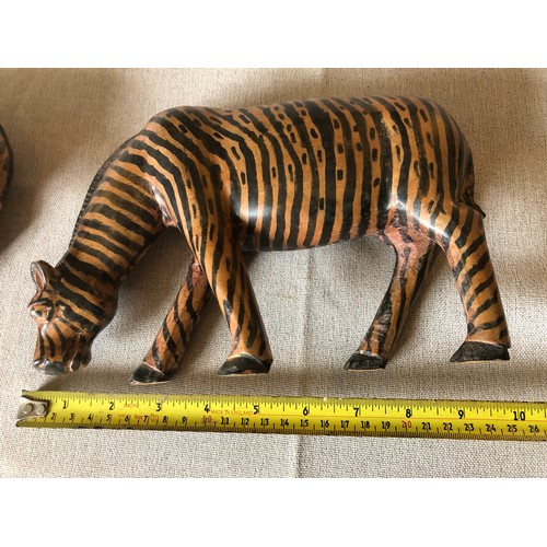 178 - A pair of hand carved wooden trbal art Zebras