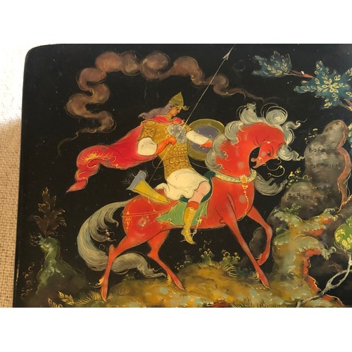 179 - A beautiful Palekh Russian lacquered painted cigarette box with warrior riding a horse in full armou... 