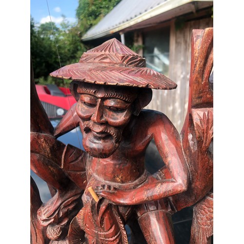 193 - Large wooden sculpture of a mud man fishing complete with rod and line