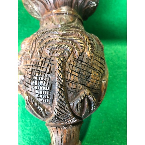 197 - Wooden tribal art vase decorated with carved camel and palm trees.