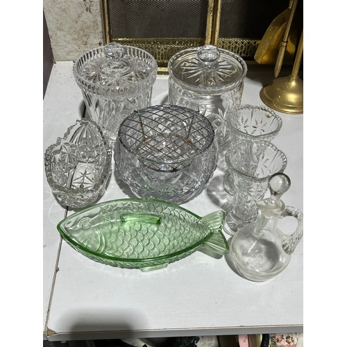 409 - A collection of cut crystal lidded jars a bowl and a green glass fish dish