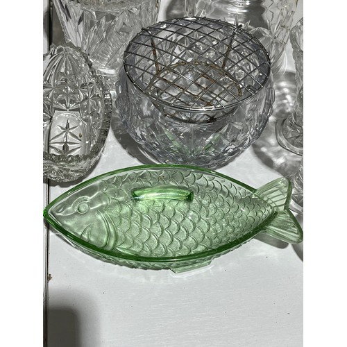 409 - A collection of cut crystal lidded jars a bowl and a green glass fish dish