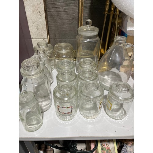 411 - Glass storage jars, all with lids