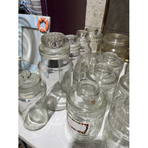 411 - Glass storage jars, all with lids