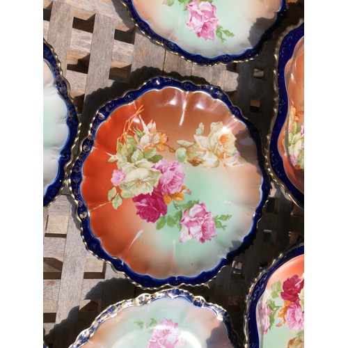 420 - A pretty Austrian  dessert service with 2 serving plates that have silver plated handles in a floral... 