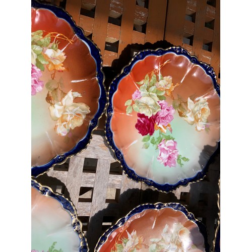 420 - A pretty Austrian  dessert service with 2 serving plates that have silver plated handles in a floral... 