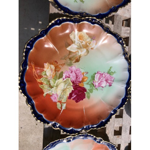 420 - A pretty Austrian  dessert service with 2 serving plates that have silver plated handles in a floral... 