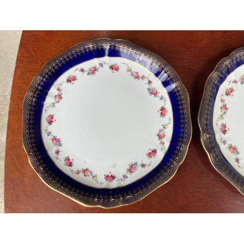 444 - Pair of Wedgwood antique plates in gold and colbalt blue with floral pattern