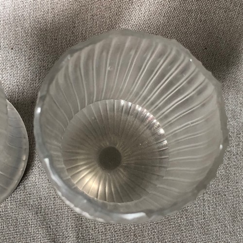 454 - A pair of iridescent glass vases on silver plated bases