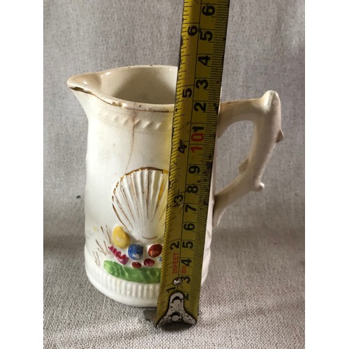 506 - Staffordshire pottery milk jug with raised molding in a nautical theme