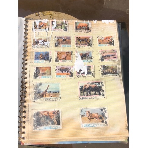 1077 - Stamp album to include many animal foreign stamps.