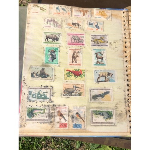 1077 - Stamp album to include many animal foreign stamps.