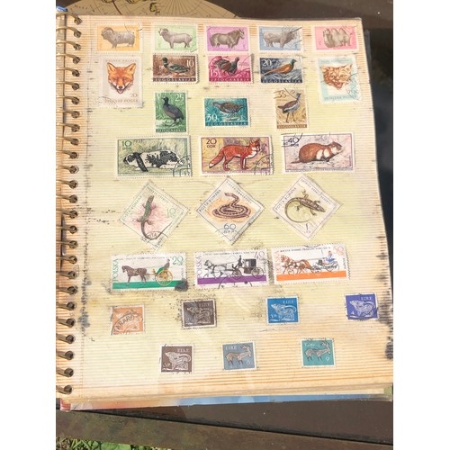 1077 - Stamp album to include many animal foreign stamps.