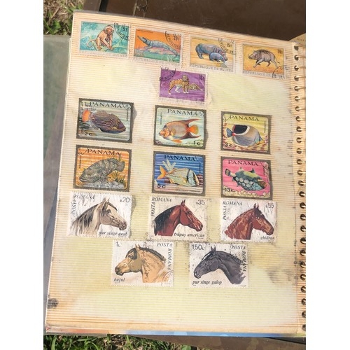 1077 - Stamp album to include many animal foreign stamps.