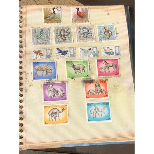 1077 - Stamp album to include many animal foreign stamps.