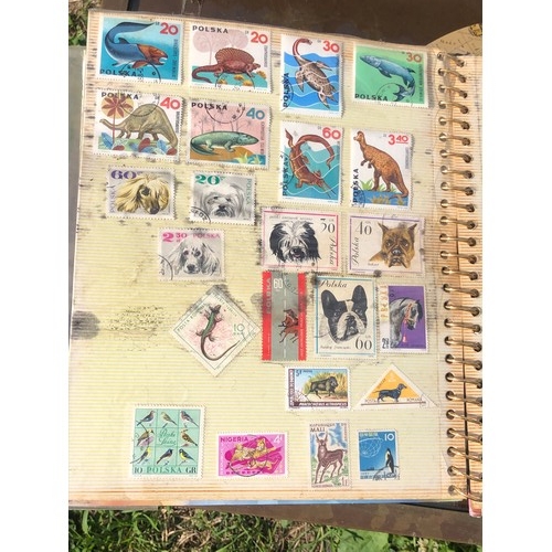 1077 - Stamp album to include many animal foreign stamps.