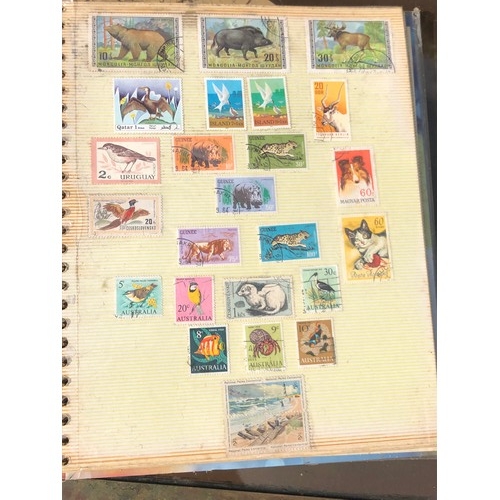 1077 - Stamp album to include many animal foreign stamps.