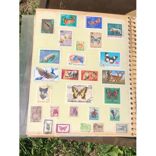 1077 - Stamp album to include many animal foreign stamps.