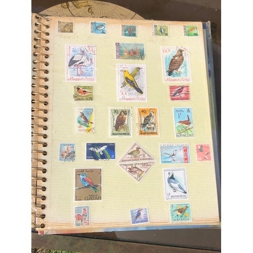 1077 - Stamp album to include many animal foreign stamps.