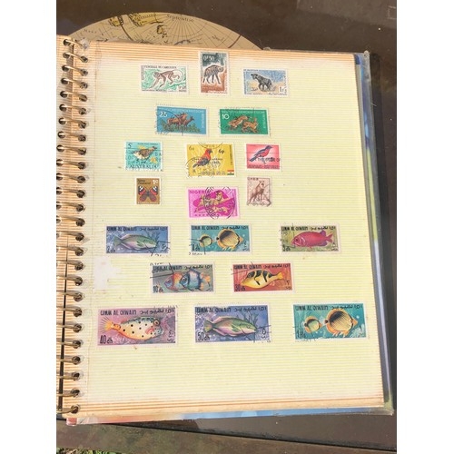 1077 - Stamp album to include many animal foreign stamps.