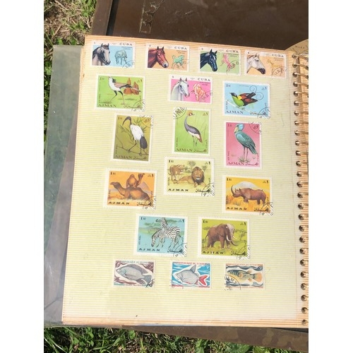 1077 - Stamp album to include many animal foreign stamps.