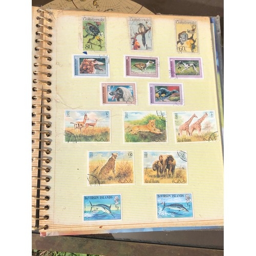 1077 - Stamp album to include many animal foreign stamps.