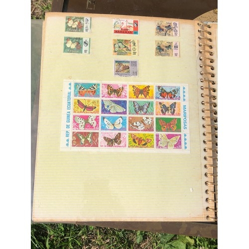 1077 - Stamp album to include many animal foreign stamps.