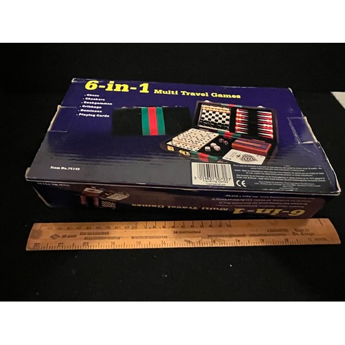 1438 - Six in one multi travel set. drafts, chess, backgammon dominoes cards cribbage checkers.