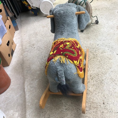 1449 - A Jade design children's plush rocking Elephant with adjustable truck