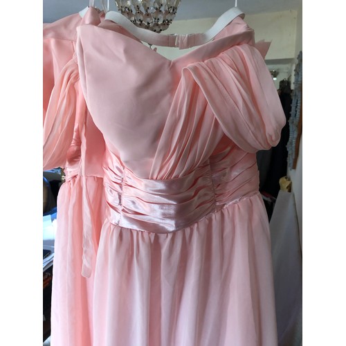 1489 - 2x Salmon pink Angel-Wardrobe Brides Maid dresses designed by Ping Feng. Both size 8.
24