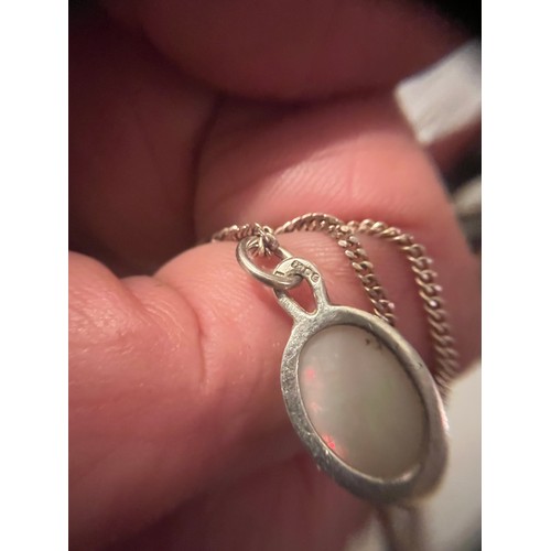 10 - Silver bound fire Opal pendant hallmarked on silver chain .925