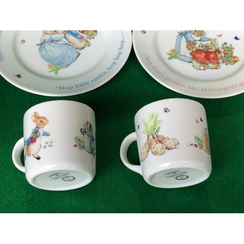 376 - Boys and Girls Peter Rabbit mugs & plates by Wedgwood.