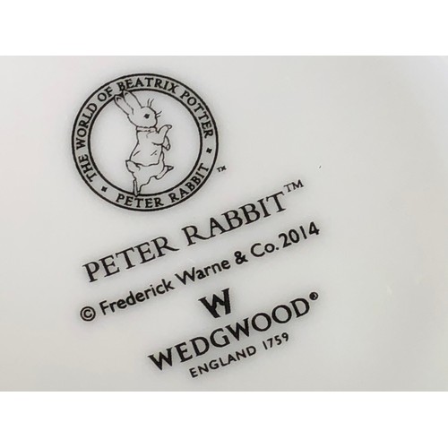 376 - Boys and Girls Peter Rabbit mugs & plates by Wedgwood.