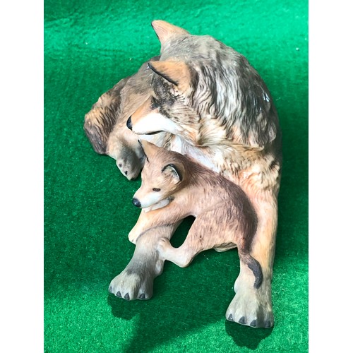 382 - Woodland repose by Nicholas Wilson. 1985 FP. Figure of a wolf with cub