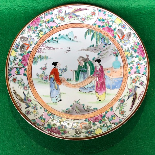 390 - A large Japanese hand painted charger plate. Impressed and Signed.