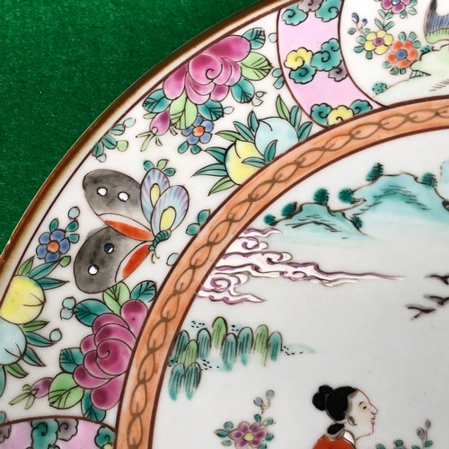 390 - A large Japanese hand painted charger plate. Impressed and Signed.