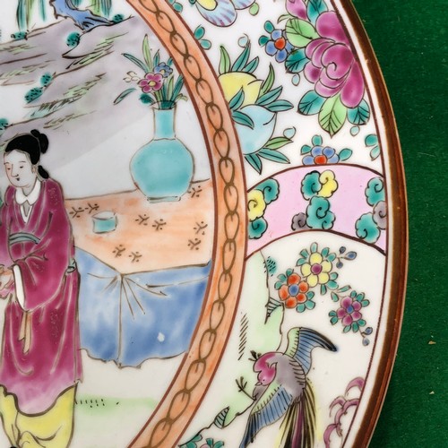 390 - A large Japanese hand painted charger plate. Impressed and Signed.