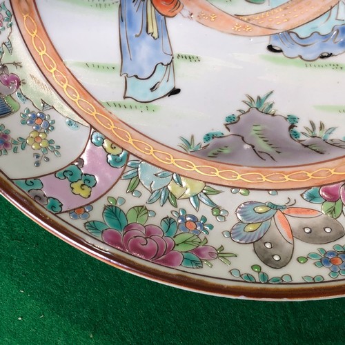 390 - A large Japanese hand painted charger plate. Impressed and Signed.