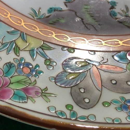 390 - A large Japanese hand painted charger plate. Impressed and Signed.