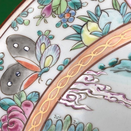 390 - A large Japanese hand painted charger plate. Impressed and Signed.