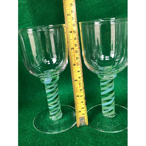 397 - Part of green and white spiral stem glasses signed Cowdy.