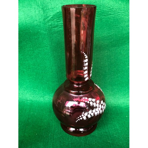 402 - Cranberry glass vase decorated in lily-of-the-valley white enamel.