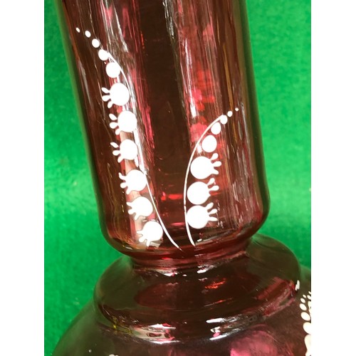 402 - Cranberry glass vase decorated in lily-of-the-valley white enamel.