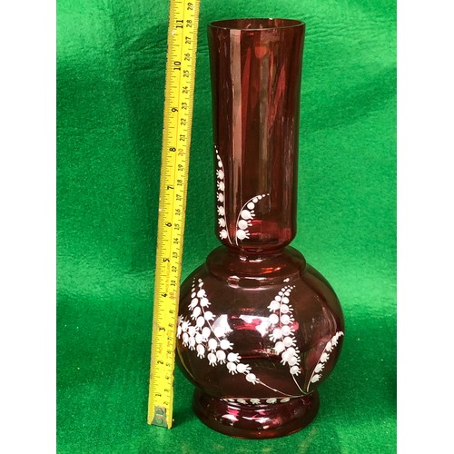 402 - Cranberry glass vase decorated in lily-of-the-valley white enamel.