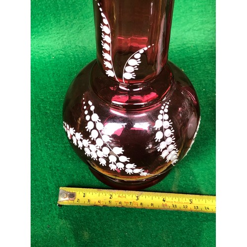 402 - Cranberry glass vase decorated in lily-of-the-valley white enamel.