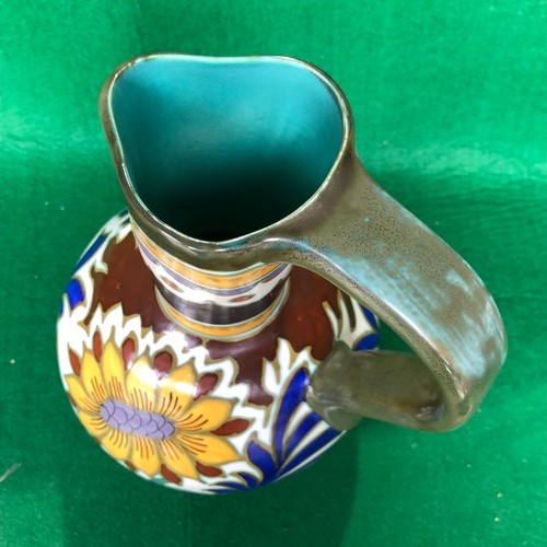 415 - A large Gouda jug in dahlia pattern